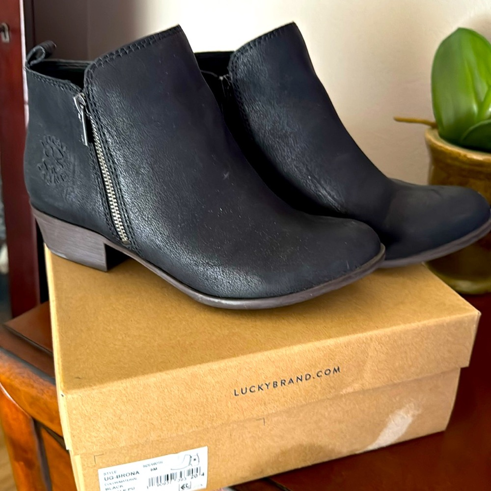 Black booties, girls size 5M and Uppers are man made.